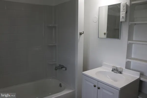 a bathroom with a sink and a bathtub