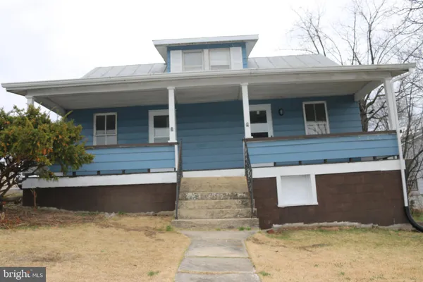 a front view of a house with yard