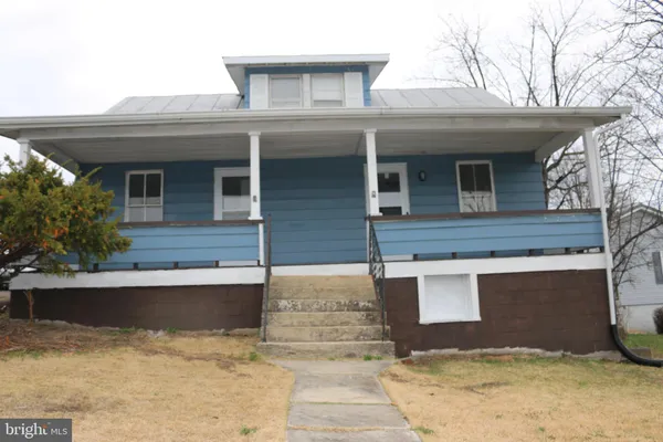 a front view of a house with yard