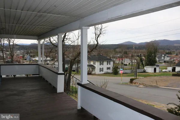 a view of a living room and a floor to ceiling window in a patio