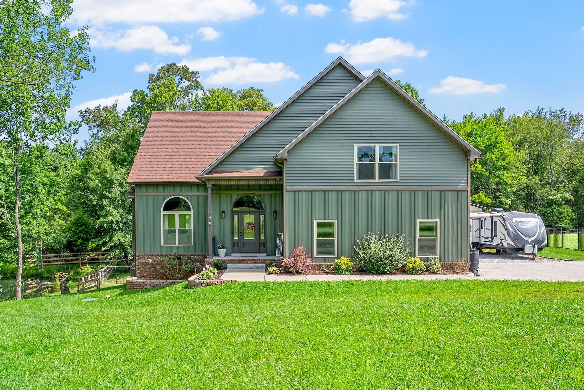 a front view of house with yard and outdoor seating