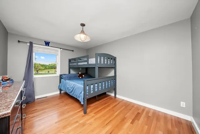 a view of a room with wooden floor
