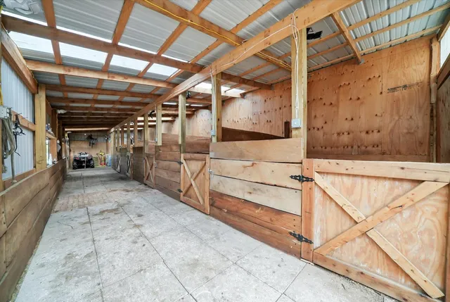 a view of empty room with wooden ceiling