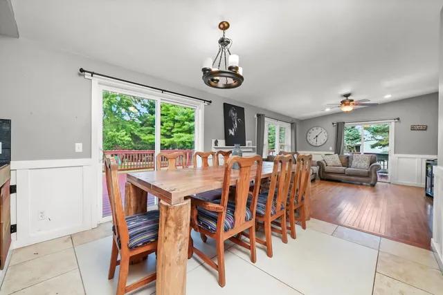 a kitchen with stainless steel appliances granite countertop a sink a stove and a refrigerator