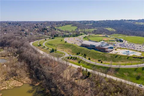 an aerial view of a house with a swimming pool