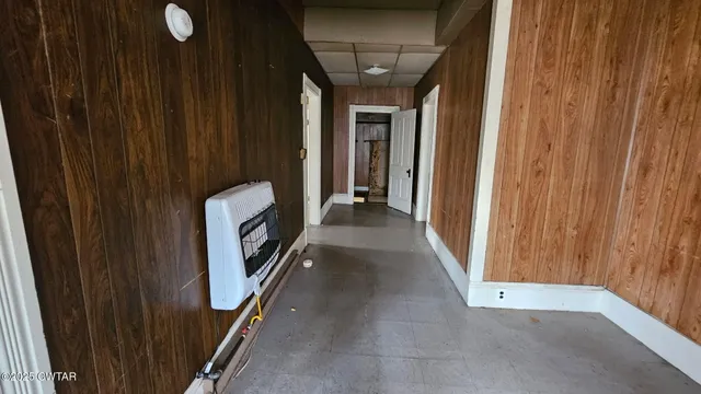 a view of a hallway with washer and dryer