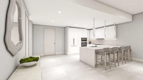 a kitchen with a sink and chairs