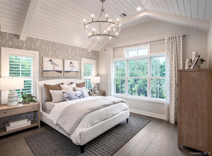 15 Marker Ridge, Unit 16 Irvington, NY 10533 - Photo 6 of 23 a bedroom with a large bed and a window