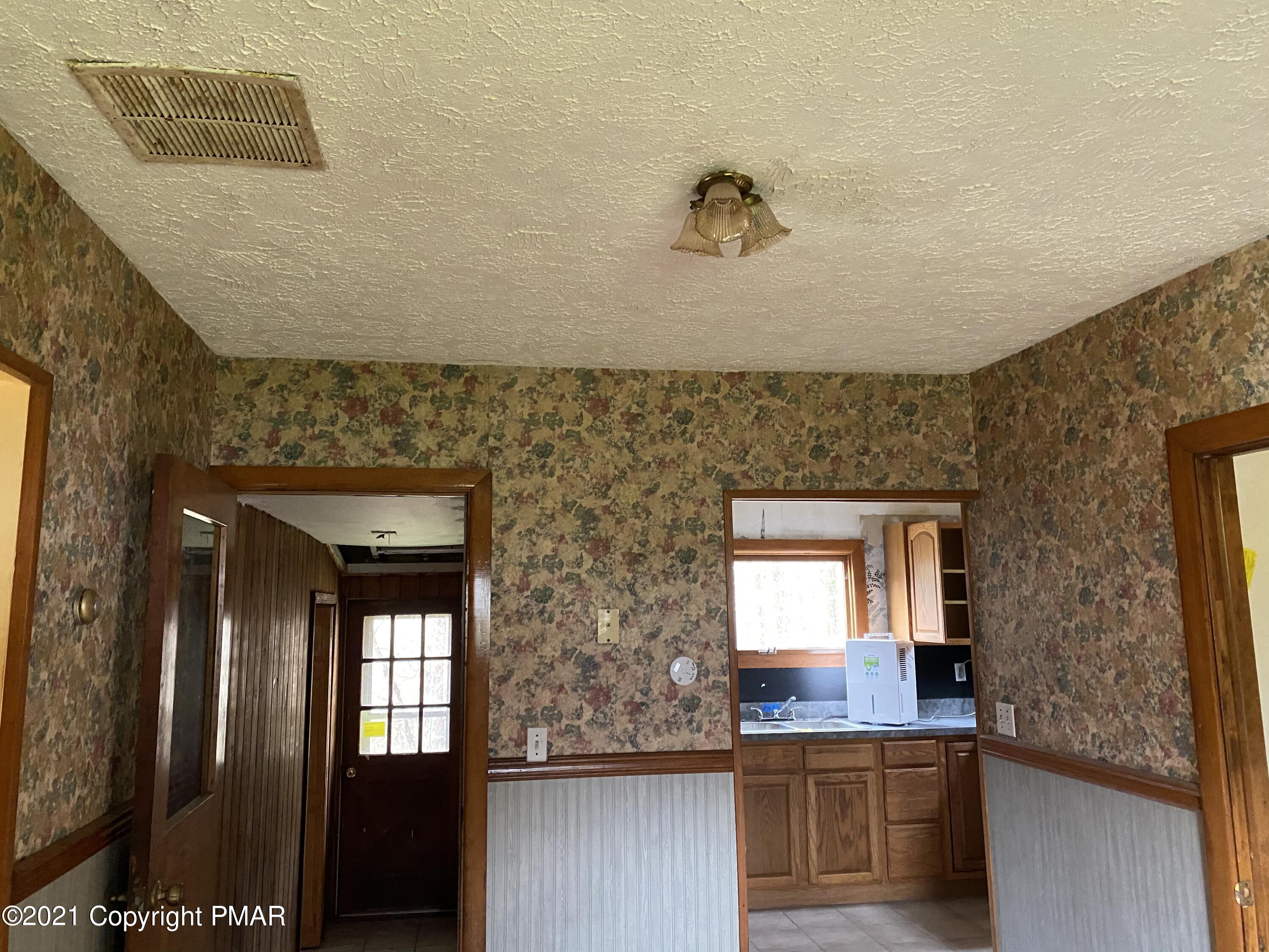 3181 Chip Path Gouldsboro, PA 18424 - Photo 4 of 13 a bathroom with a sink and a mirror