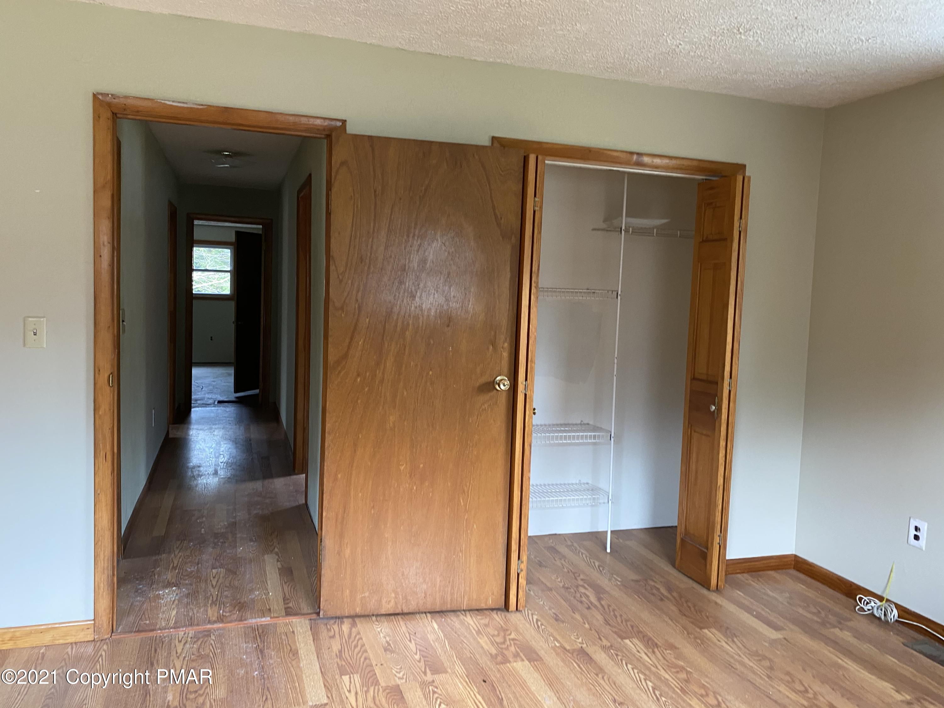 3181 Chip Path Gouldsboro, PA 18424 - Photo 9 of 13 a view of a hallway with wooden floor and closet