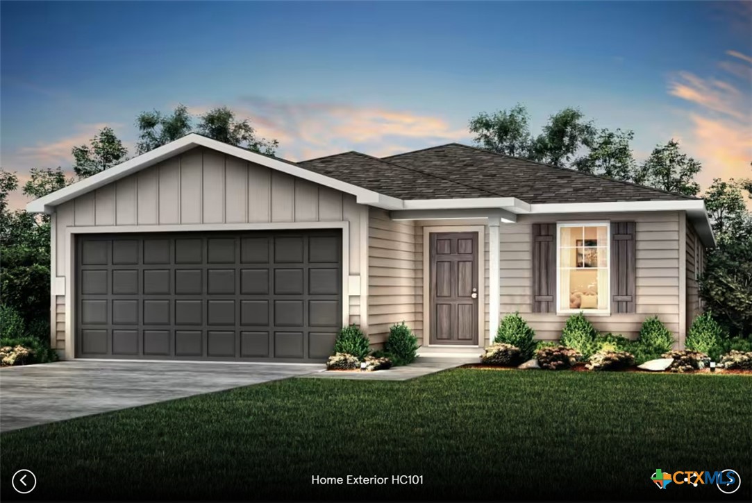 482 Kapok Street Buda, TX 78610 - Photo 1 of 1 a view of a house with a small yard and a garden