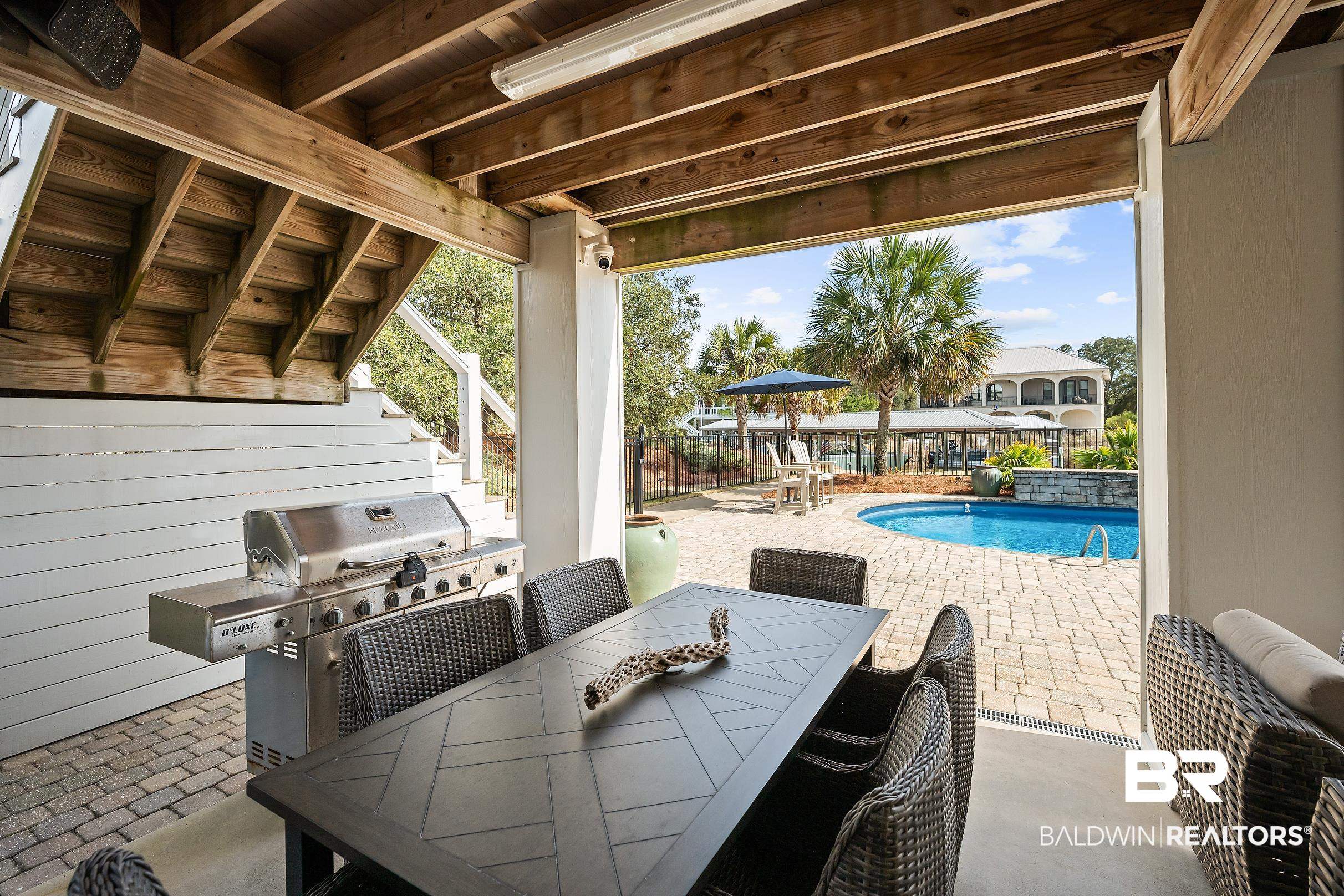 33186 Marlin Key Drive Orange Beach, AL 36561 - Photo 80 of 87 View of patio / terrace featuring an outdoor pool, outdoor dining area, and a grill
