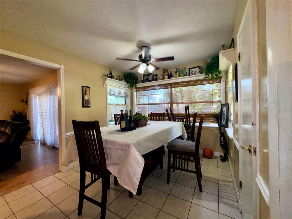 2908 Forest Circle Seffner, FL 33584 - Photo 18 of 46 a view of a dining room with furniture and a chandelier