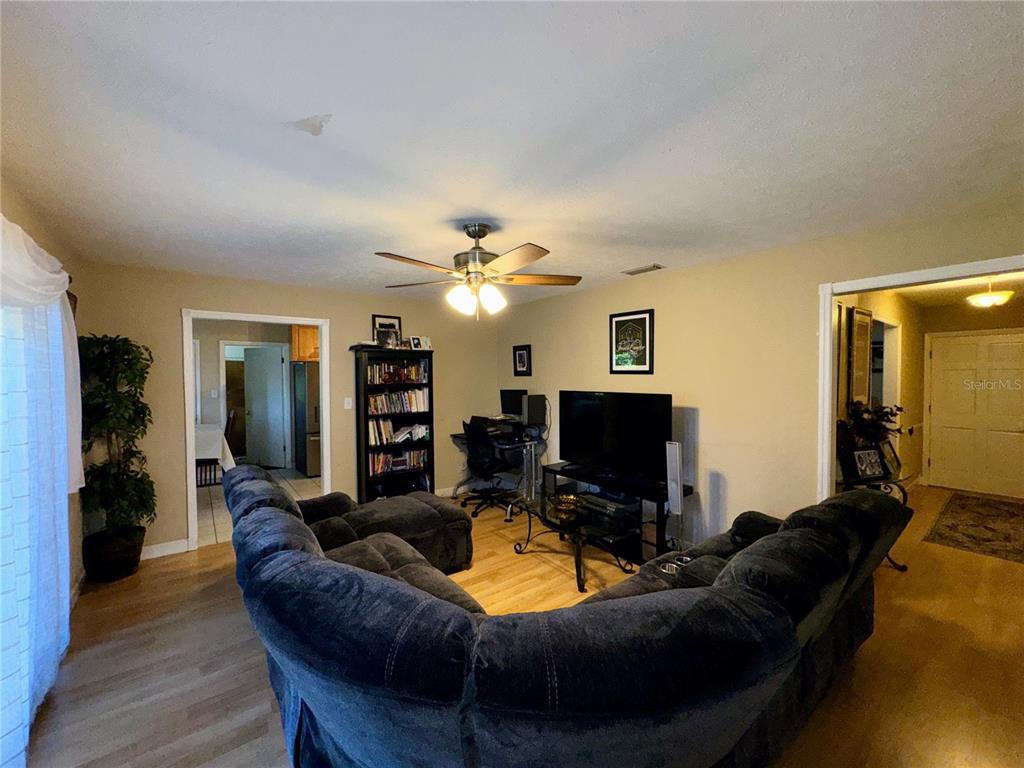2908 Forest Circle Seffner, FL 33584 - Photo 21 of 46 a living room with furniture and a flat screen tv