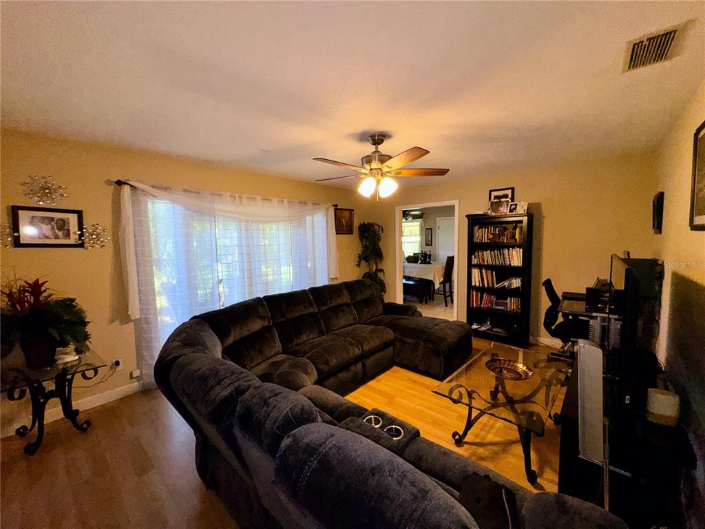 2908 Forest Circle Seffner, FL 33584 - Photo 22 of 46 a living room with furniture and a flat screen tv