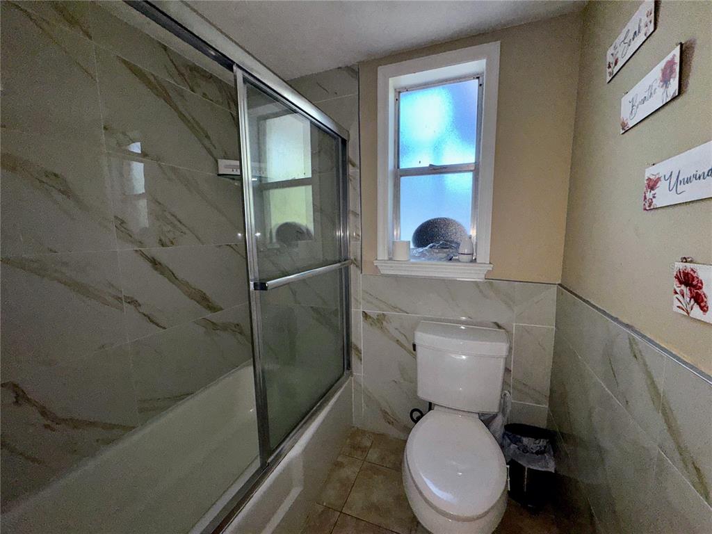 2908 Forest Circle Seffner, FL 33584 - Photo 24 of 46 a white toilet sitting next to a bathroom sink