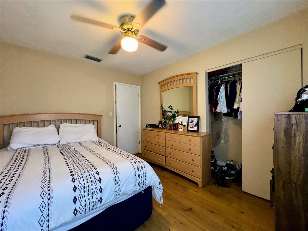 2908 Forest Circle Seffner, FL 33584 - Photo 25 of 46 a bedroom with a bed and a dresser