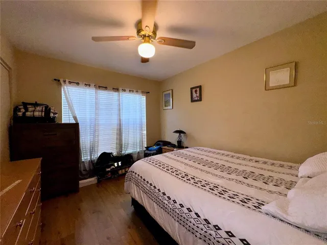 a bedroom with two beds and a window