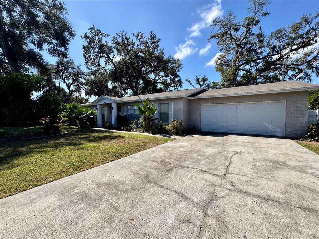 2908 Forest Circle Seffner, FL 33584 - Photo 3 of 46 a front view of a house with a yard