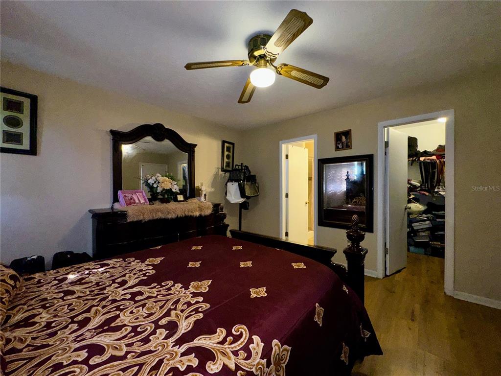 2908 Forest Circle Seffner, FL 33584 - Photo 32 of 46 a bed room with a bed and a mirror
