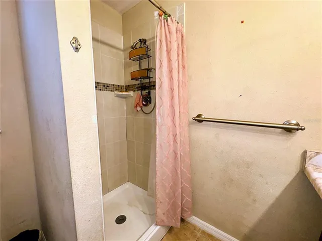 a white toilet sitting next to a bathroom sink