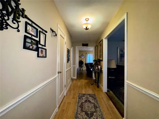 a living room with furniture a ceiling fan and a window