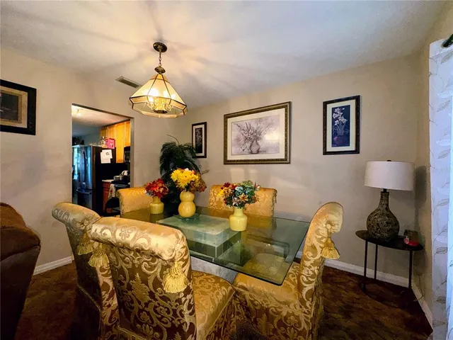 a living room with furniture chandelier and a chandelier