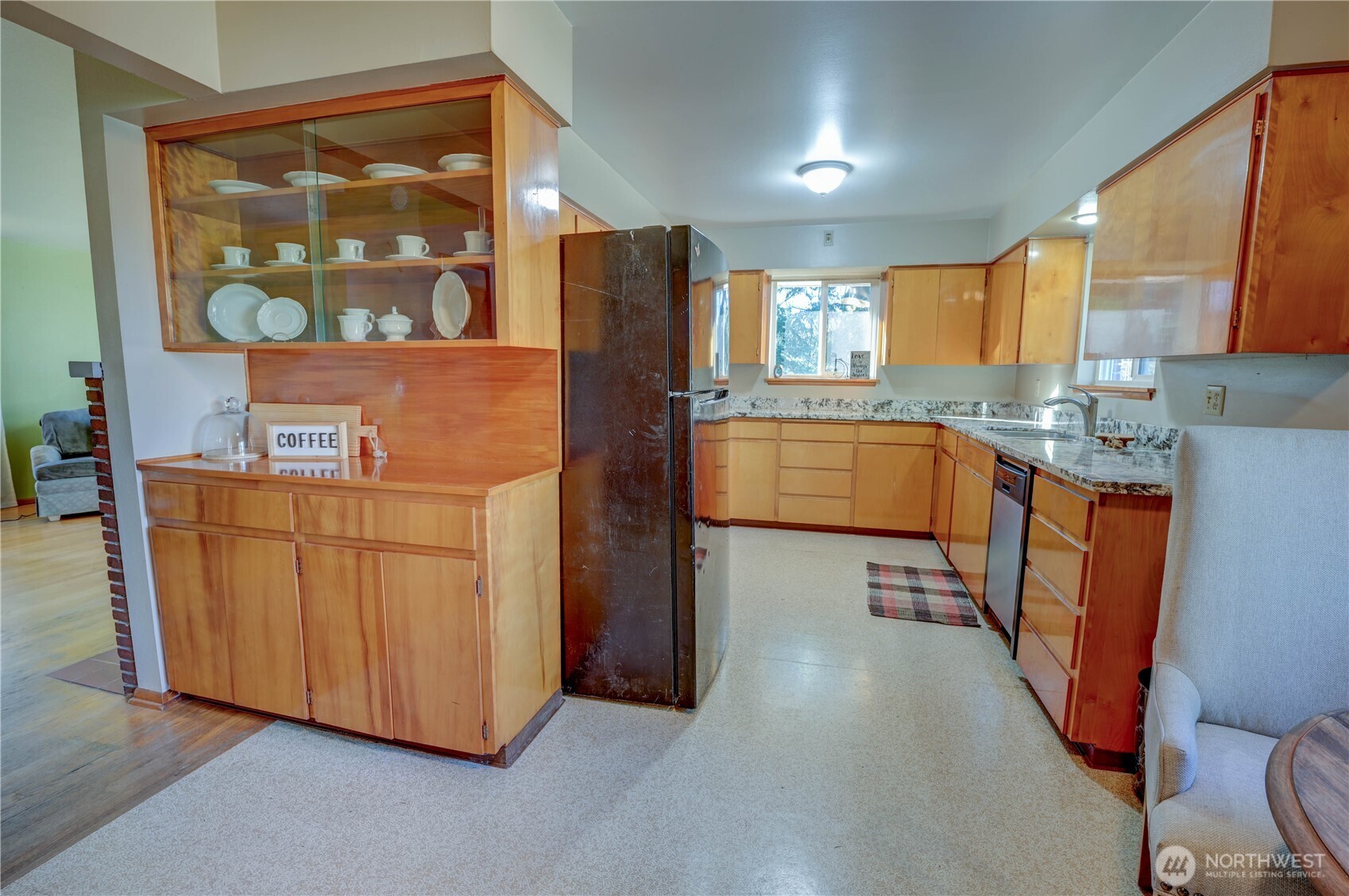 20221 Church Lake Road East Bonney Lake, WA 98391 - Photo 11 of 37 a kitchen with stainless steel appliances granite countertop a refrigerator a stove and a wooden cabinets
