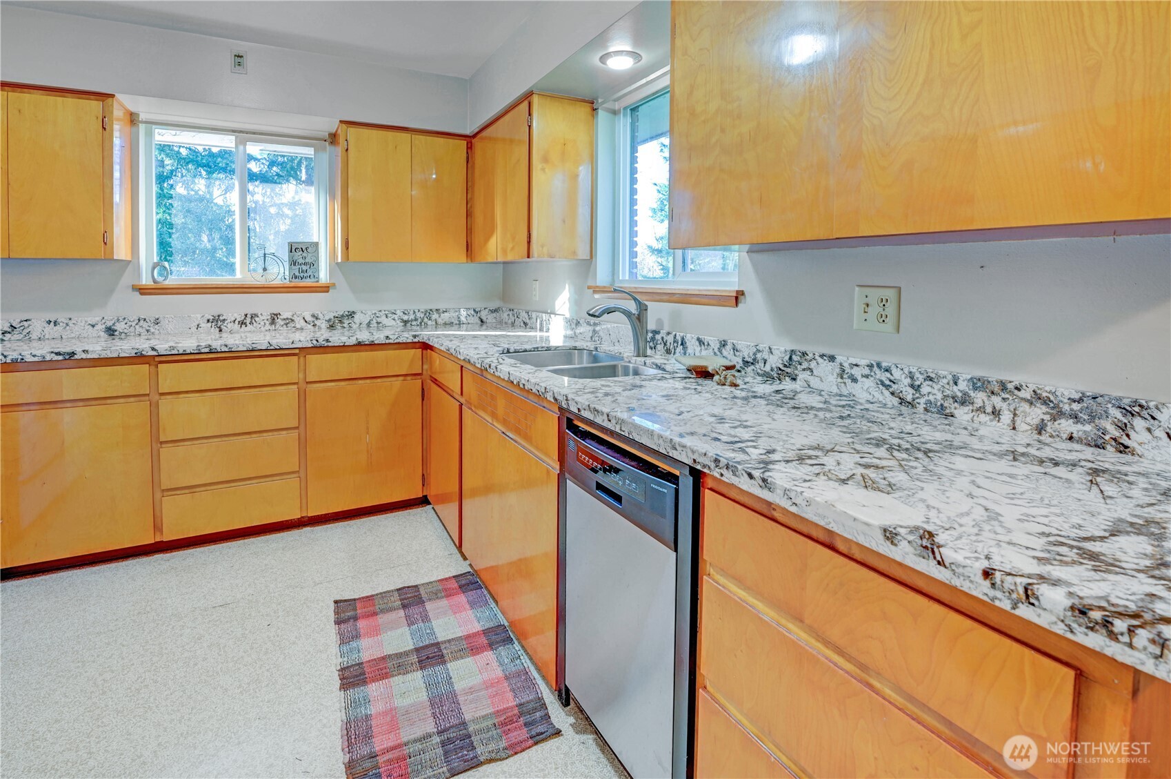 20221 Church Lake Road East Bonney Lake, WA 98391 - Photo 14 of 37 a kitchen with stainless steel appliances granite countertop a sink and cabinets