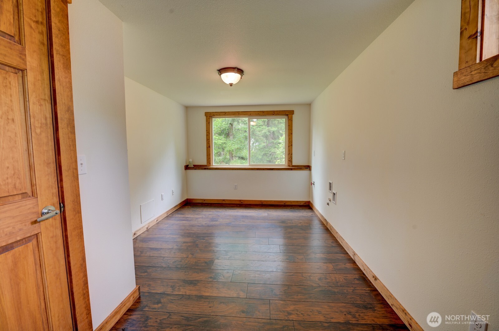 20221 Church Lake Road East Bonney Lake, WA 98391 - Photo 24 of 37 an empty room with wooden floor and windows