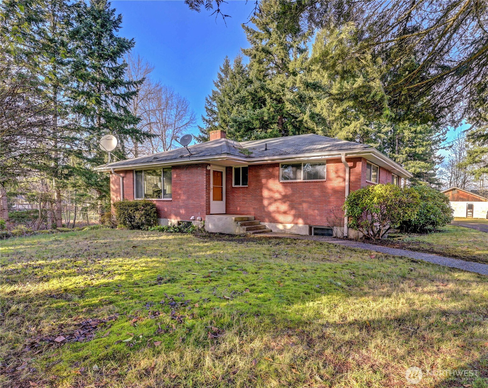 20221 Church Lake Road East Bonney Lake, WA 98391 - Photo 5 of 37 a front view of house with yard and trees
