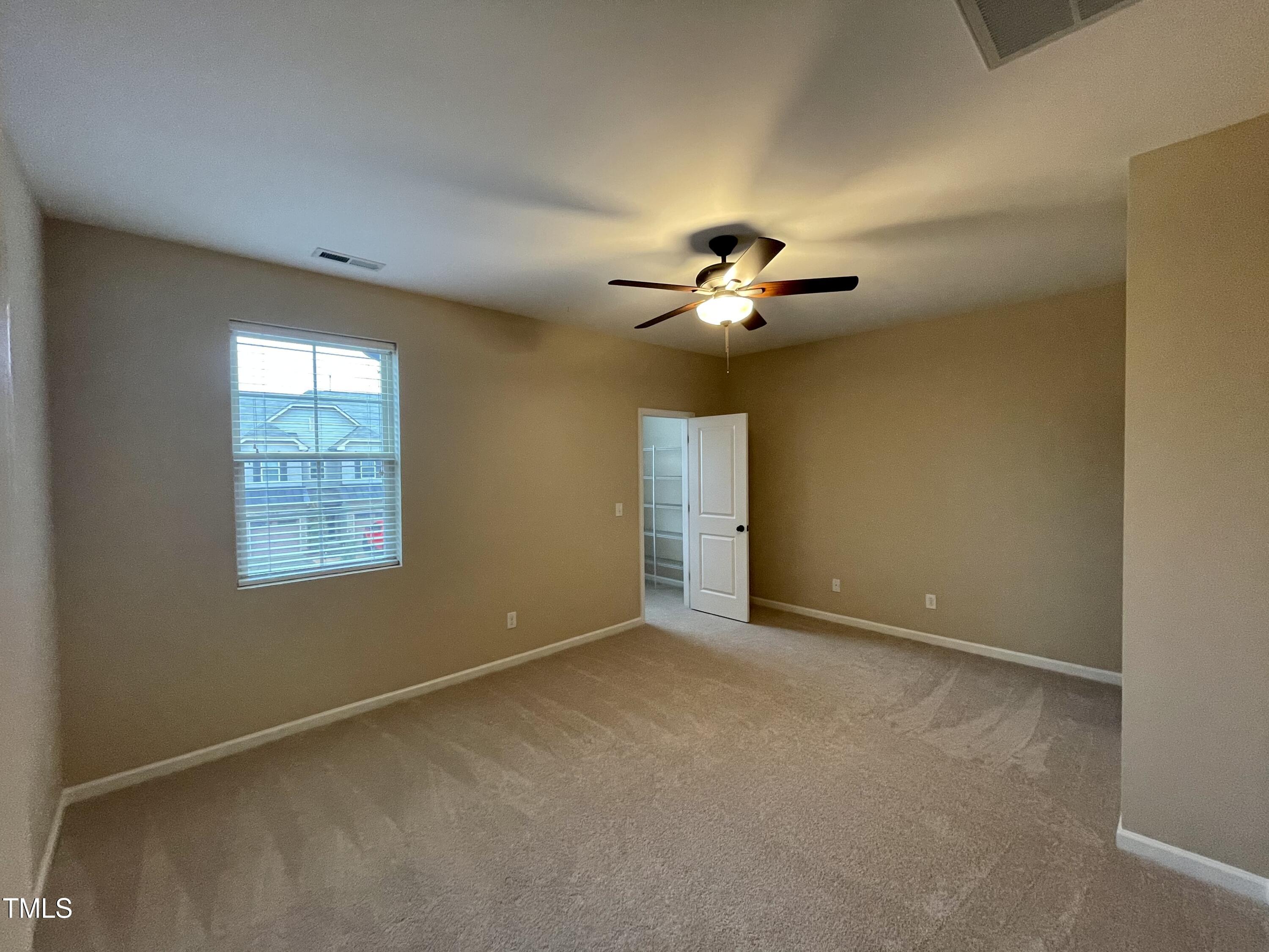 2452 Baslow Drive Apex, NC 27539 - Photo 12 of 25 a view of an empty room with a window