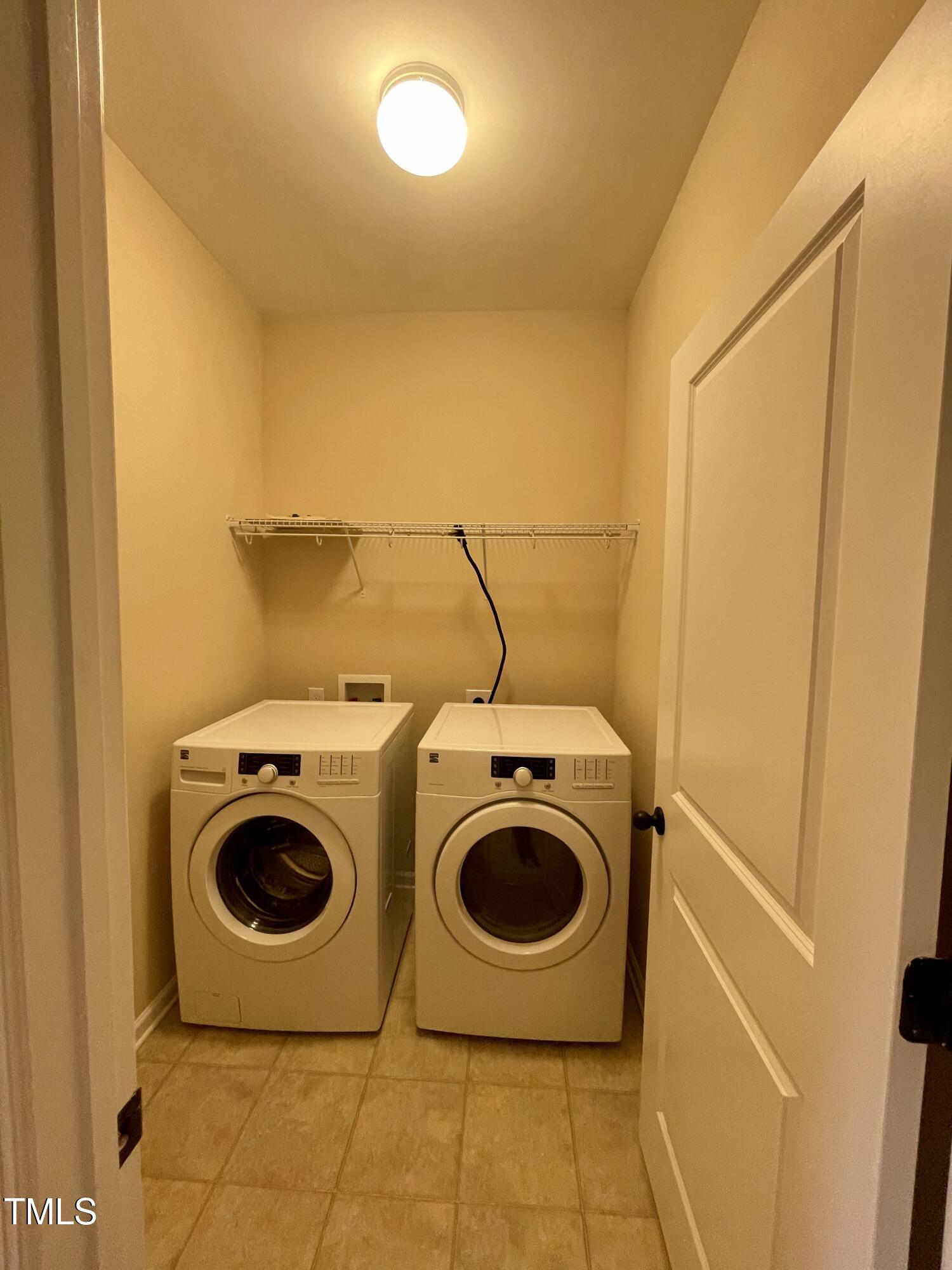 2452 Baslow Drive Apex, NC 27539 - Photo 17 of 25 a utility room with dryer and washer