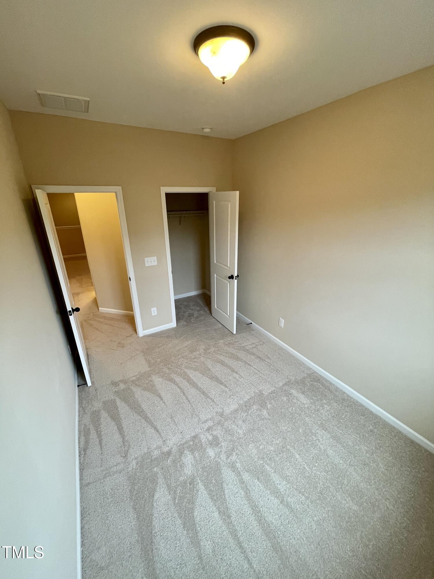 2452 Baslow Drive Apex, NC 27539 - Photo 20 of 25 an empty room with a window