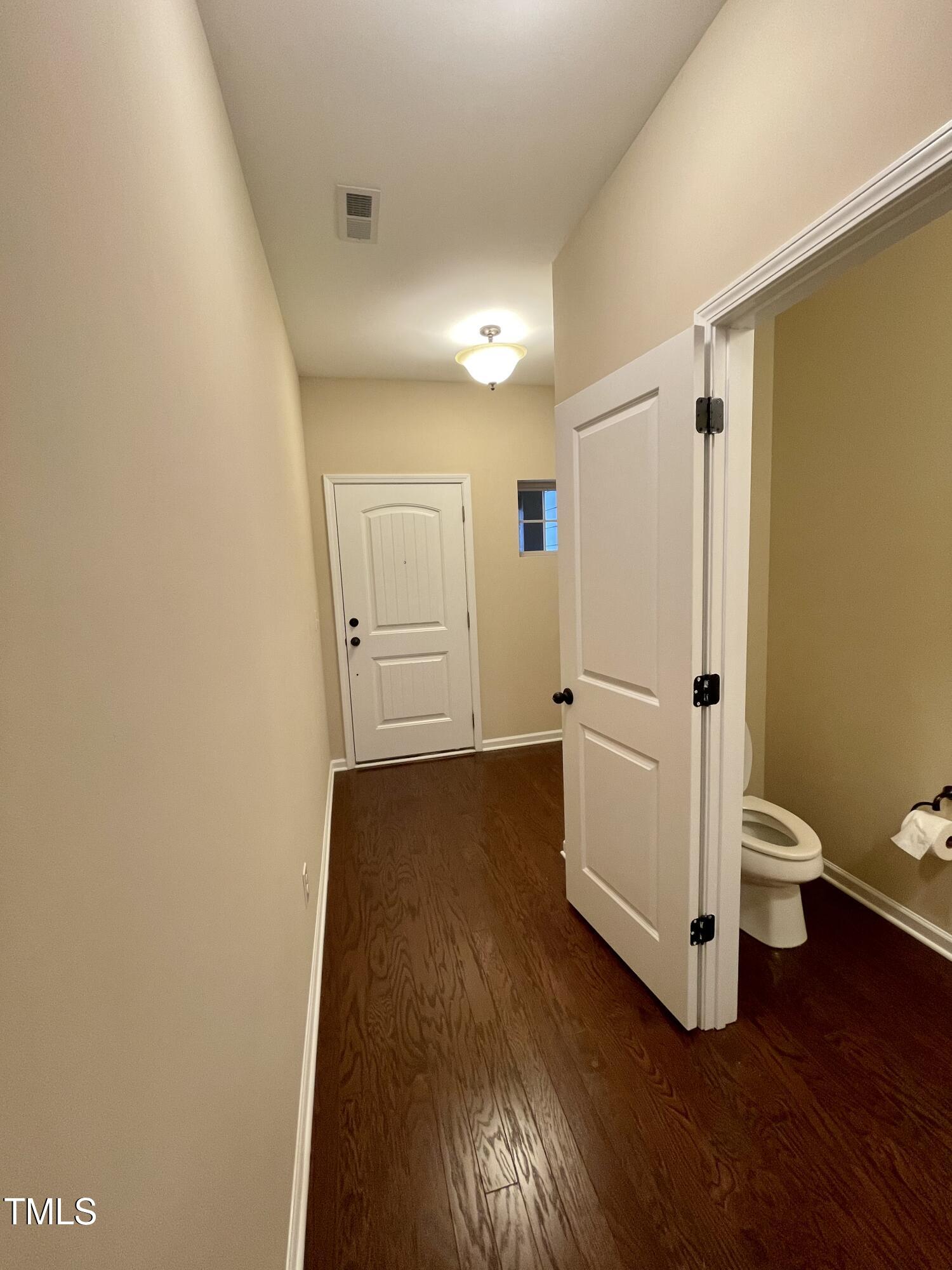 2452 Baslow Drive Apex, NC 27539 - Photo 3 of 25 a bathroom with a sink and a toilet