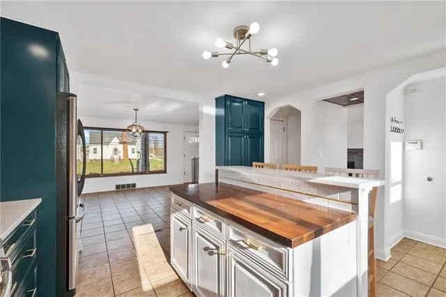 a spacious bathroom with a sink and a mirror