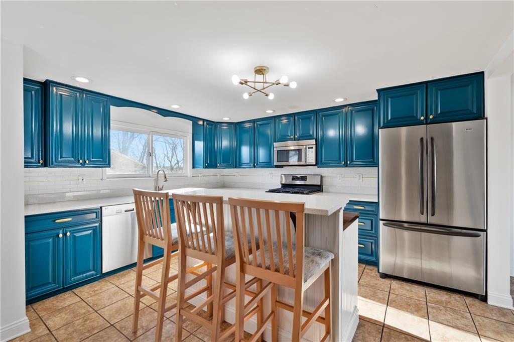 1430 James Street Monroeville, PA 15146 - Photo 12 of 36 a kitchen with a refrigerator a sink and dishwasher
