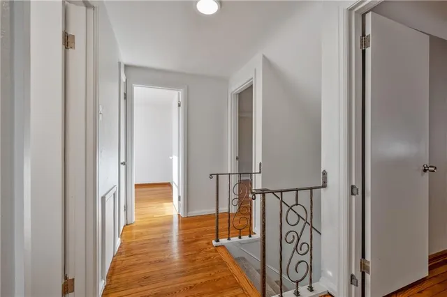a view of hallway with wooden floor