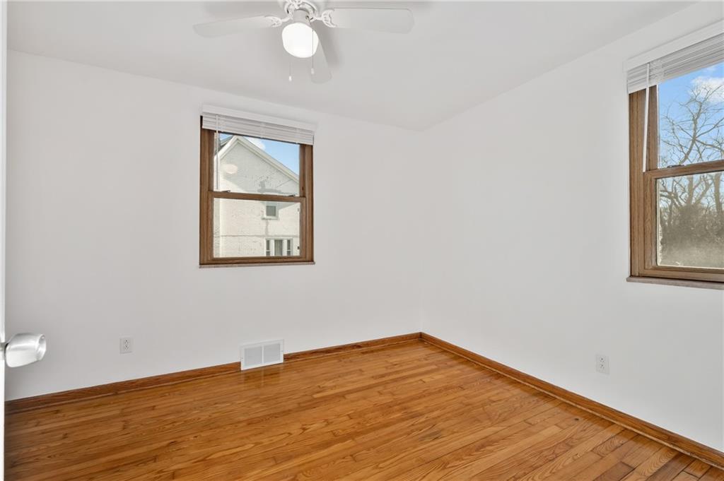 1430 James Street Monroeville, PA 15146 - Photo 15 of 36 an empty room with wooden floor and windows