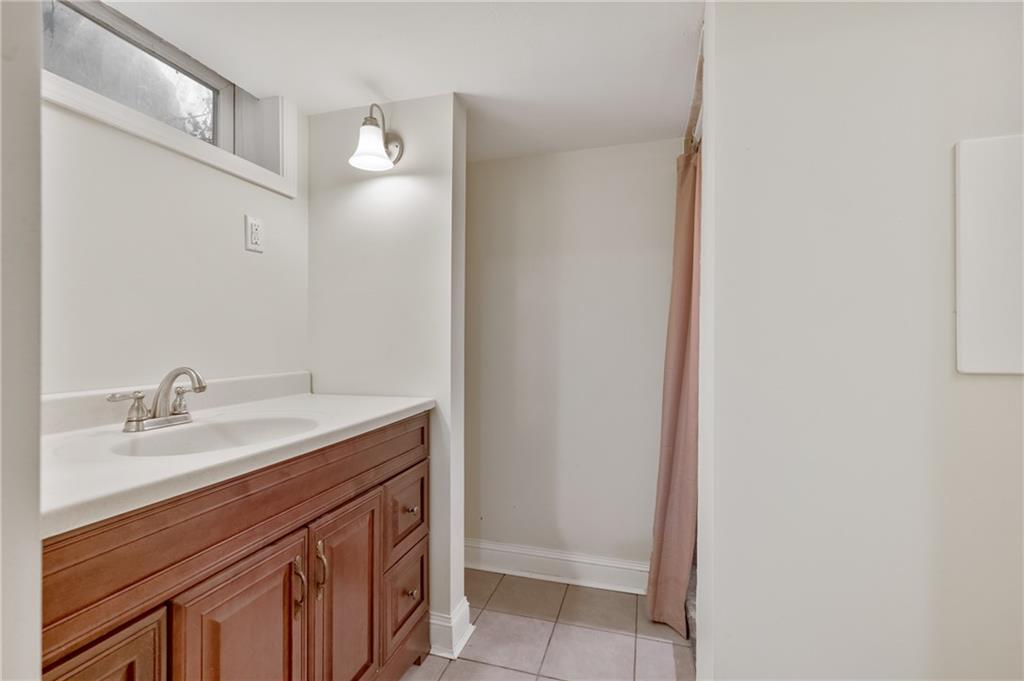 1430 James Street Monroeville, PA 15146 - Photo 27 of 36 a bathroom with a sink and a mirror