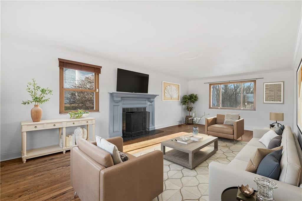 1430 James Street Monroeville, PA 15146 - Photo 3 of 36 a living room with furniture a fireplace and a flat screen tv