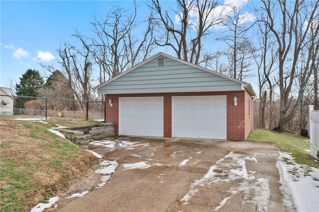 1430 James Street Monroeville, PA 15146 - Photo 31 of 36 a front view of a house with a yard and garage
