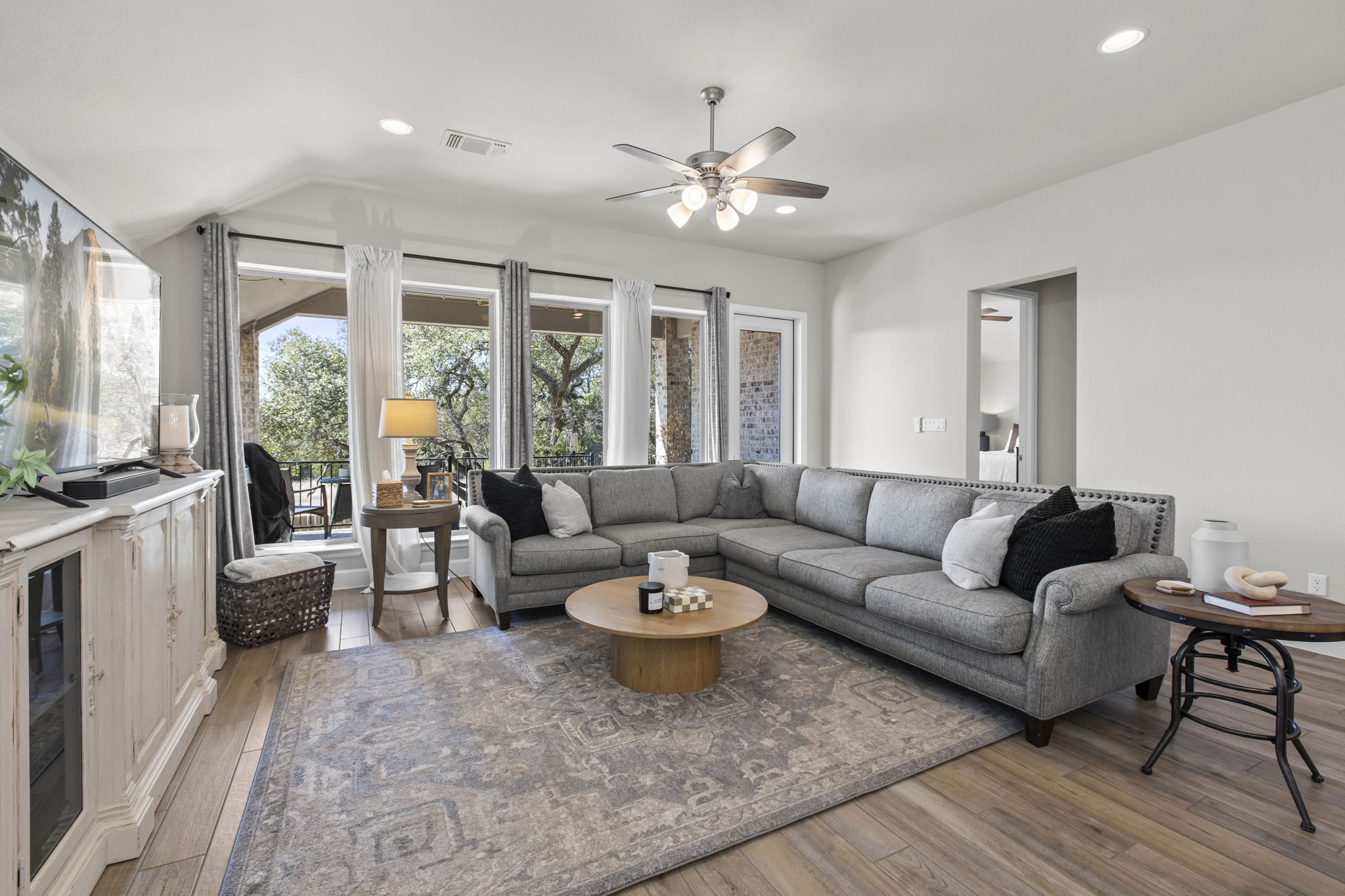 313 Terrene Trail Georgetown, TX 78628 - Photo 11 of 40 Living area with recessed lighting, ceiling fan, and light wood-style flooring