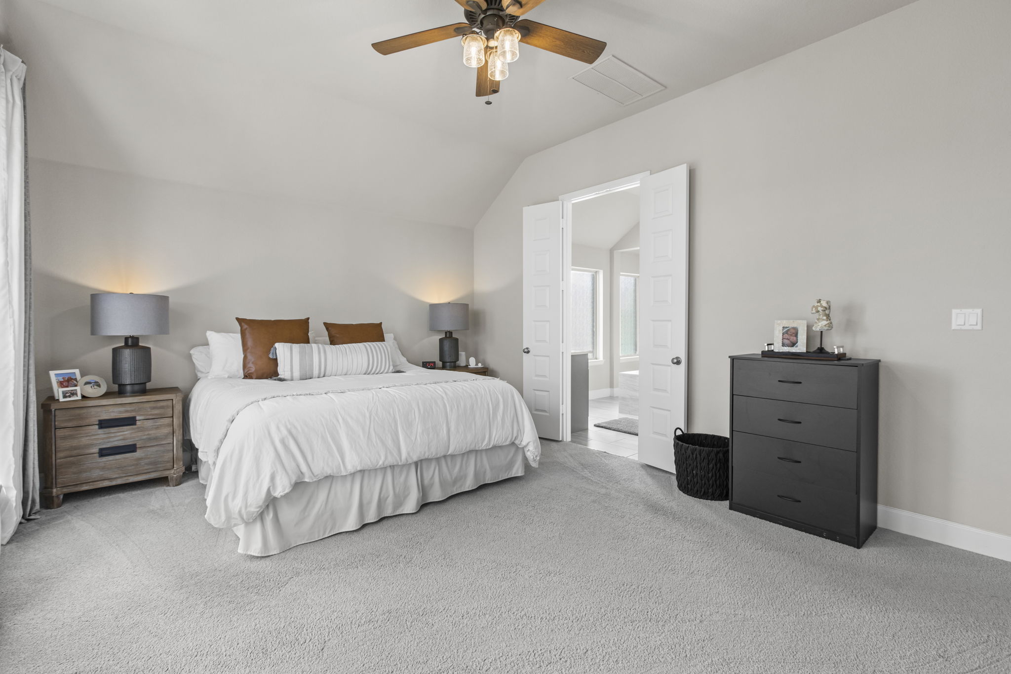 313 Terrene Trail Georgetown, TX 78628 - Photo 14 of 40 Carpeted bedroom featuring vaulted ceiling and a ceiling fan