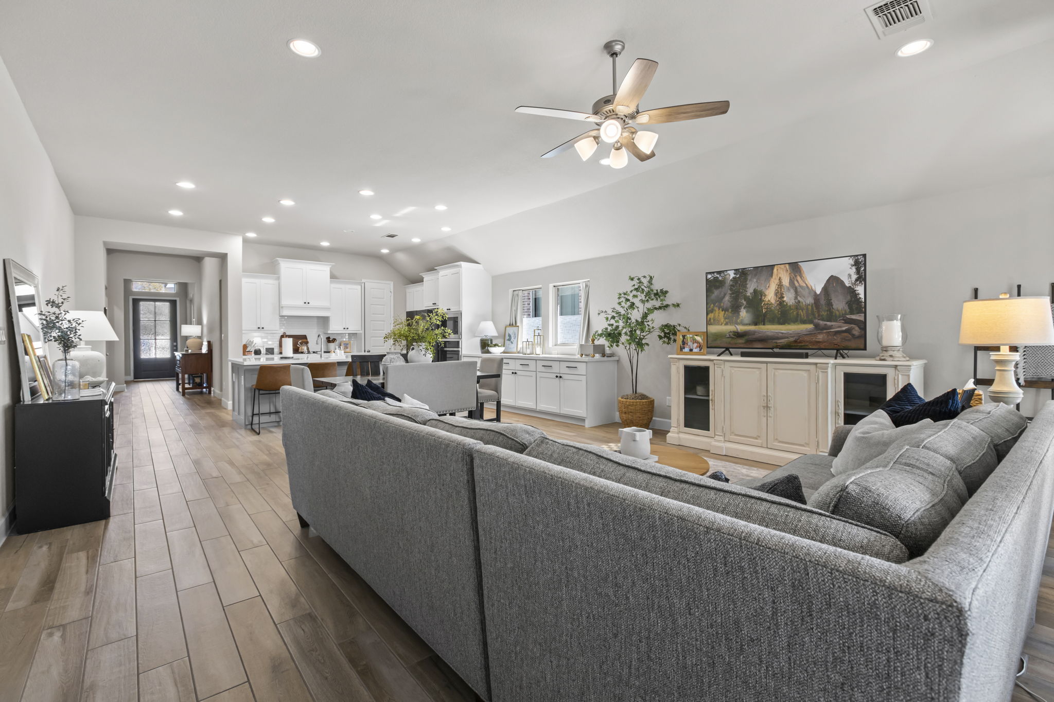 313 Terrene Trail Georgetown, TX 78628 - Photo 8 of 40 Living room featuring recessed lighting, dark wood-style floors, ceiling fan, and vaulted ceiling