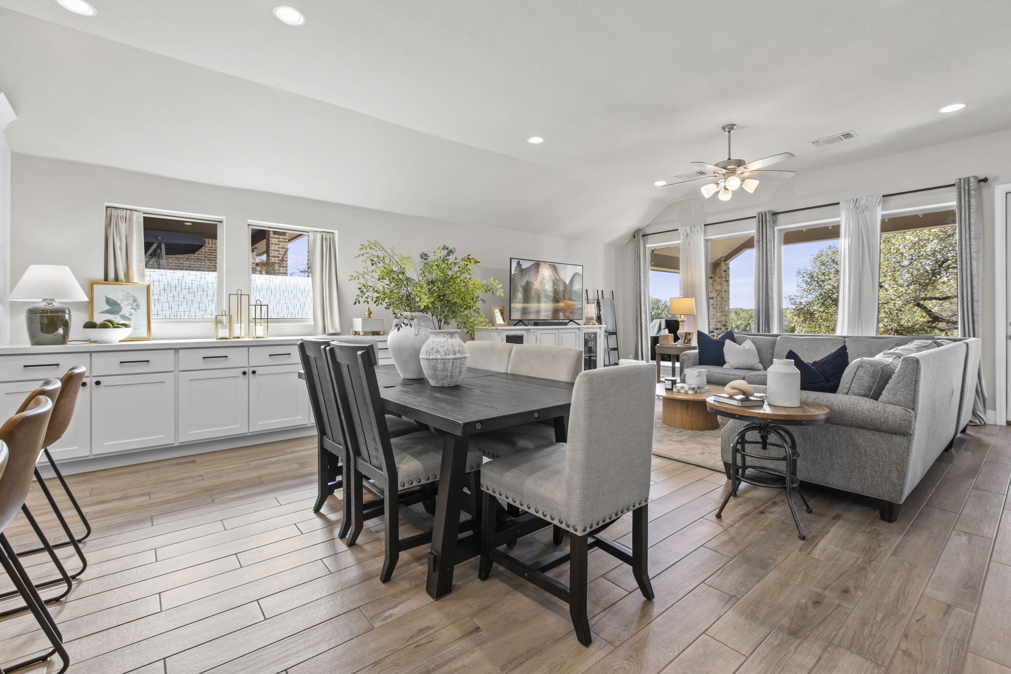 313 Terrene Trail Georgetown, TX 78628 - Photo 9 of 40 Dining room with vaulted ceiling, light wood finished floors, recessed lighting, and ceiling fan