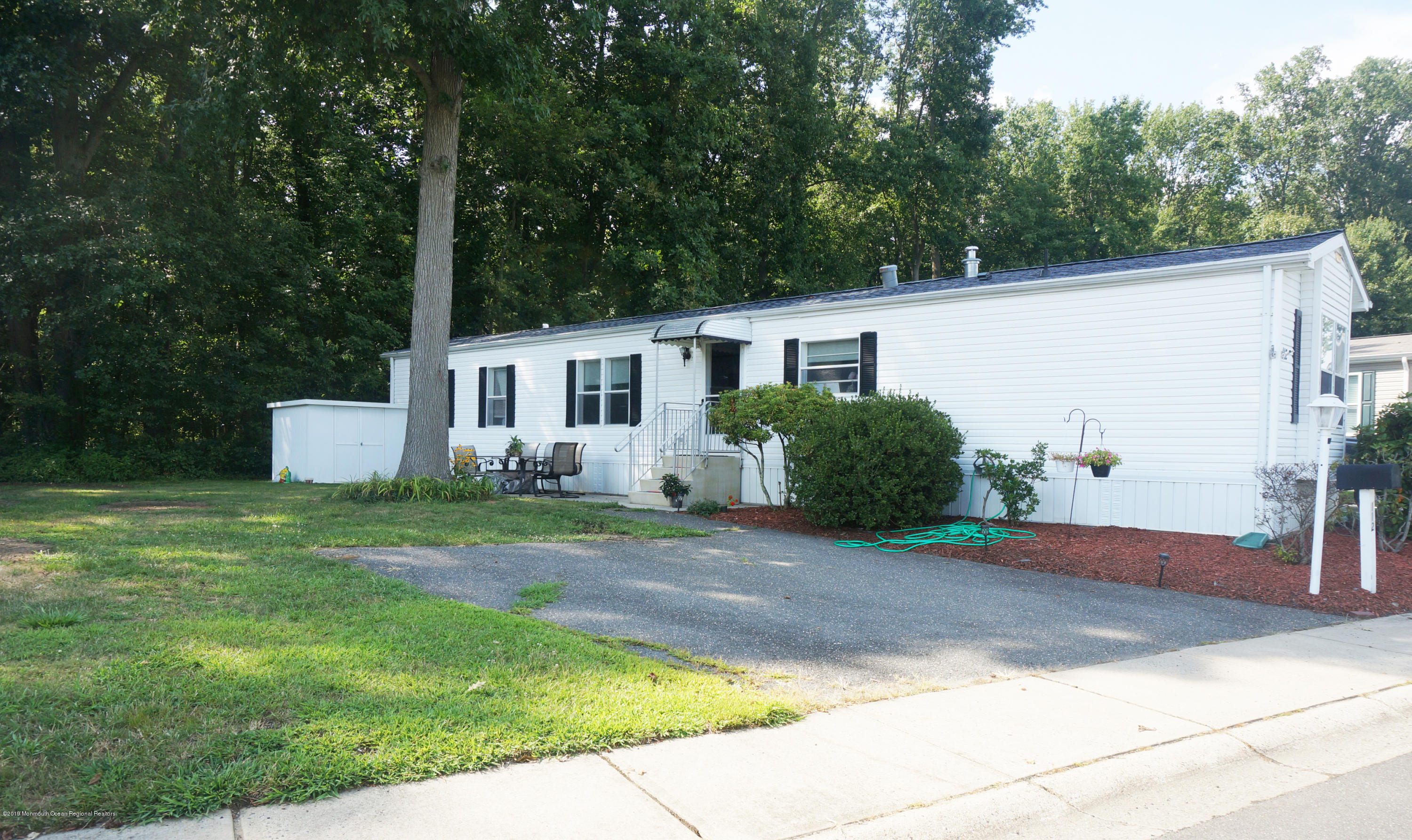 112 Woody Road Freehold, NJ 07728 - Photo 3 of 28 a front view of a house with a yard