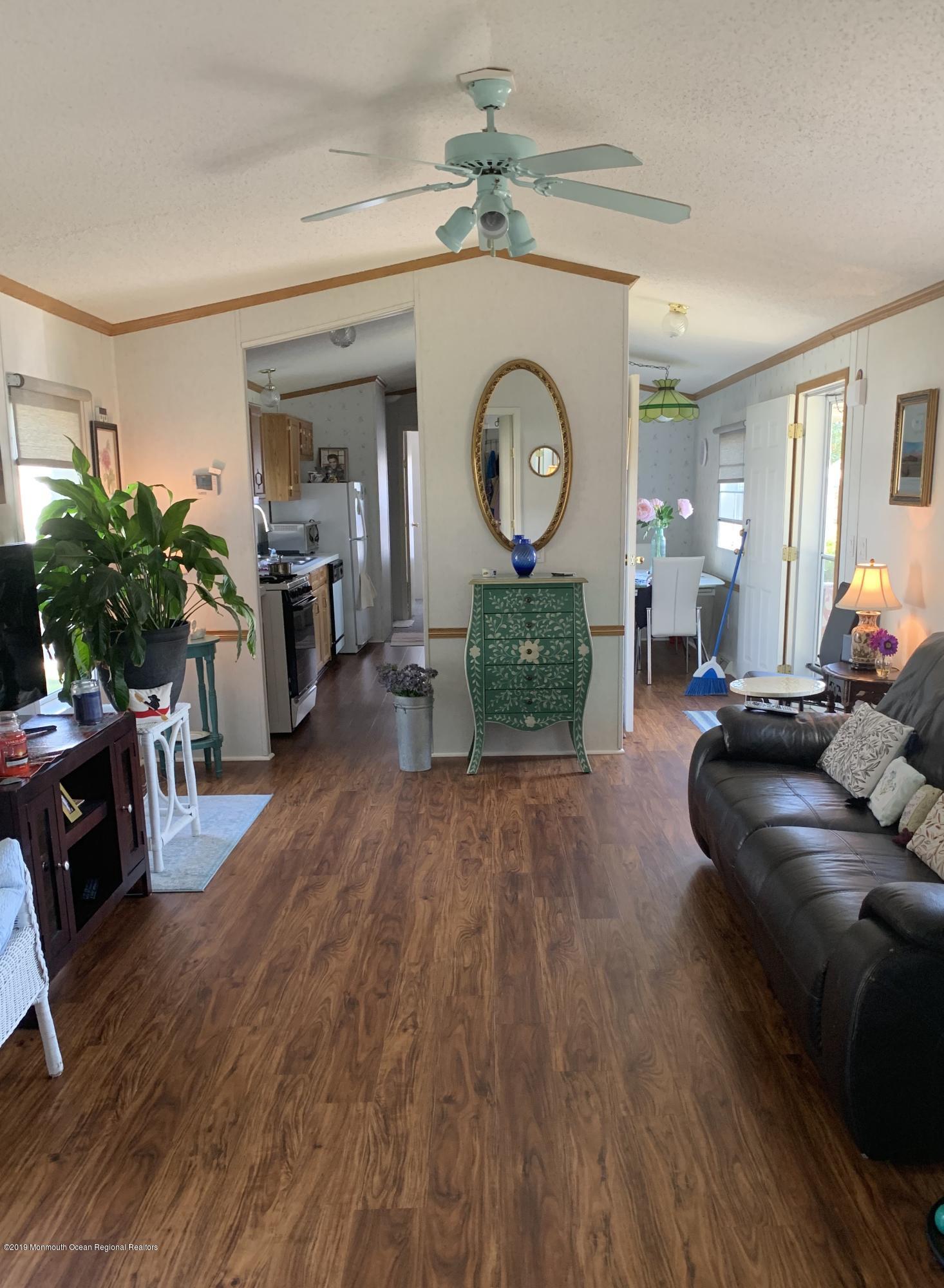 112 Woody Road Freehold, NJ 07728 - Photo 6 of 28 a living room with furniture and a fireplace
