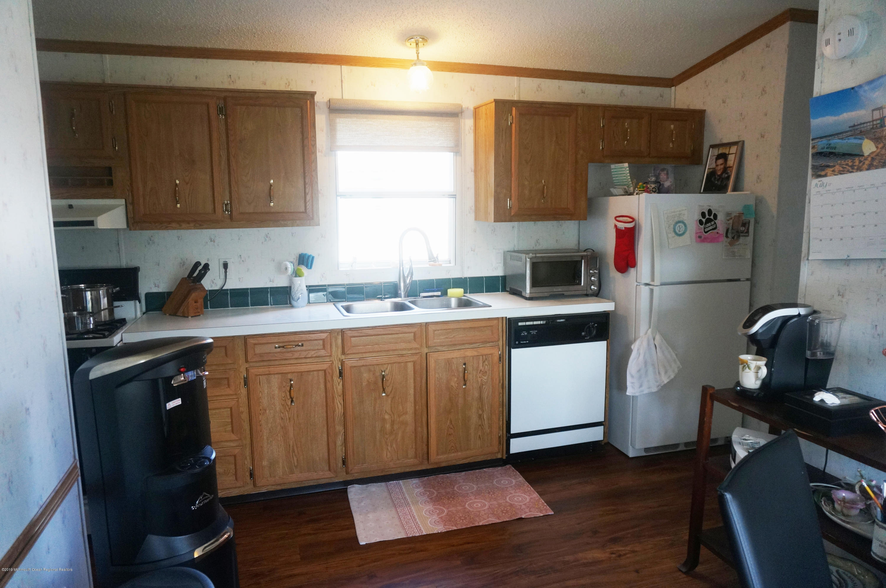 112 Woody Road Freehold, NJ 07728 - Photo 7 of 28 a kitchen with a refrigerator stove and sink