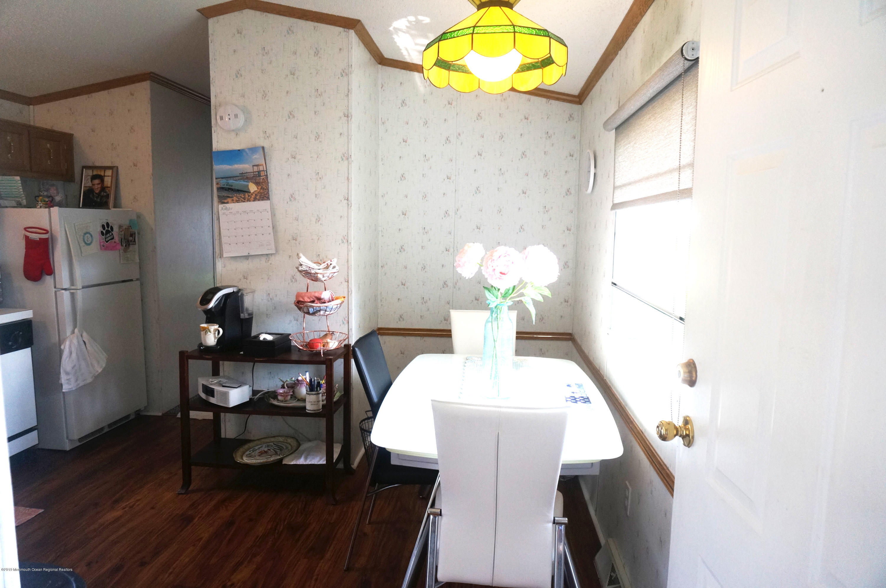 112 Woody Road Freehold, NJ 07728 - Photo 9 of 28 a view of a dining room with furniture and wooden floor